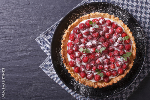 Gourmet raspberry tart with cheese cream close-up. Horizontal top view
