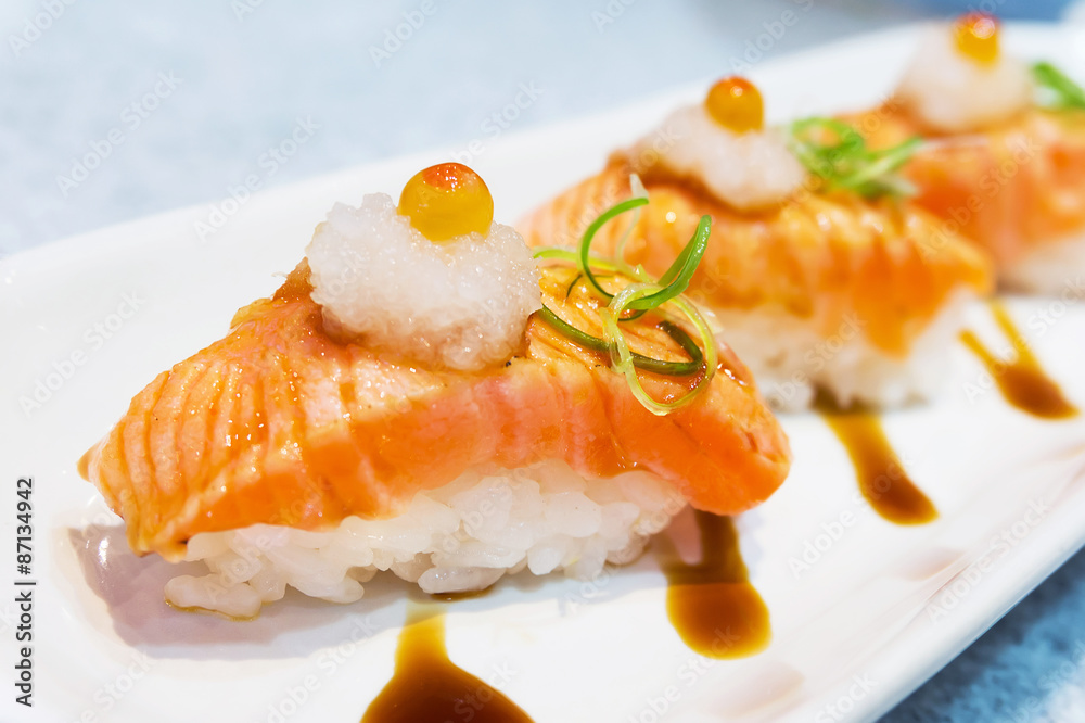 Grilled salmon sushi with selective focus point Grilled salmon sushi with selective focus point