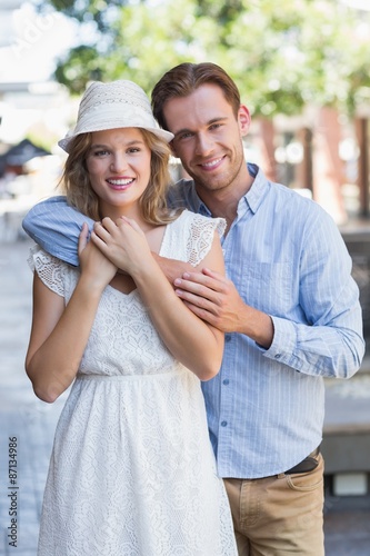 Standing cute couple looking at the camera