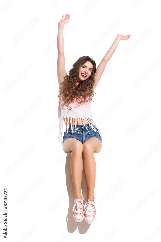 Smiling Girl Sitting And Waving Hands