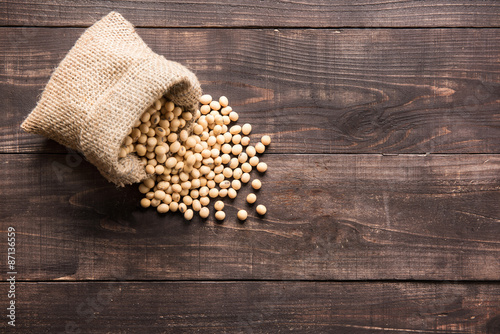 Top view soybean on wooden background and empty space