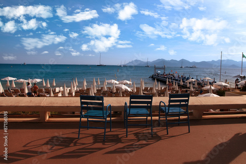 CANNES, FRANCE -  JULY 5, 2014.  Three chairs for guests on Croi