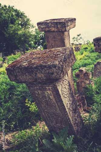 Close up image of old gravestones