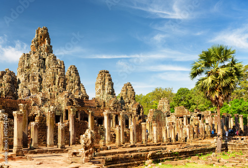 Main view of ancient Bayon temple in Angkor Thom in evening sun