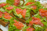 Sandwiches with salmon, lettuce and cucumber