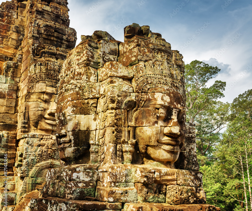 Enigmatic smiling giant stone faces of Bayon temple, Angkor Thom Enigmatic smiling giant stone faces of Bayon temple, Angkor Thom