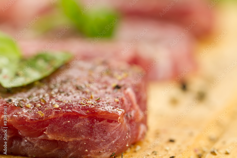 fresh raw pork on cutting Board with spices and herbs. ?lose up fresh raw pork on cutting Board with spices and herbs. ?lose up