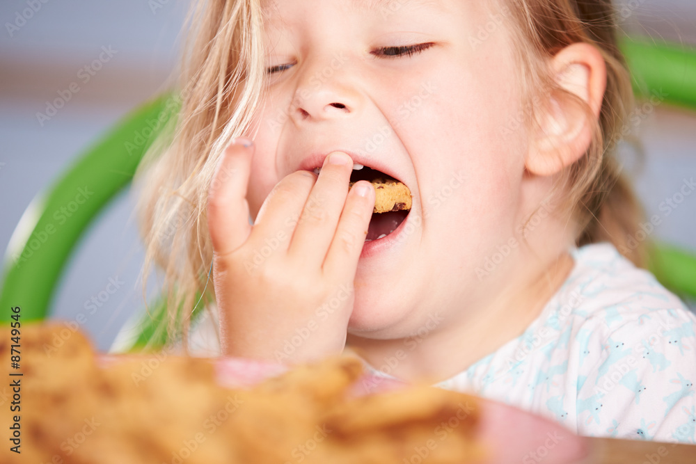 Close Up Of Girl Eating Chocolate Chip Cookie Close Up Of Girl Eating Chocolate Chip Cookie