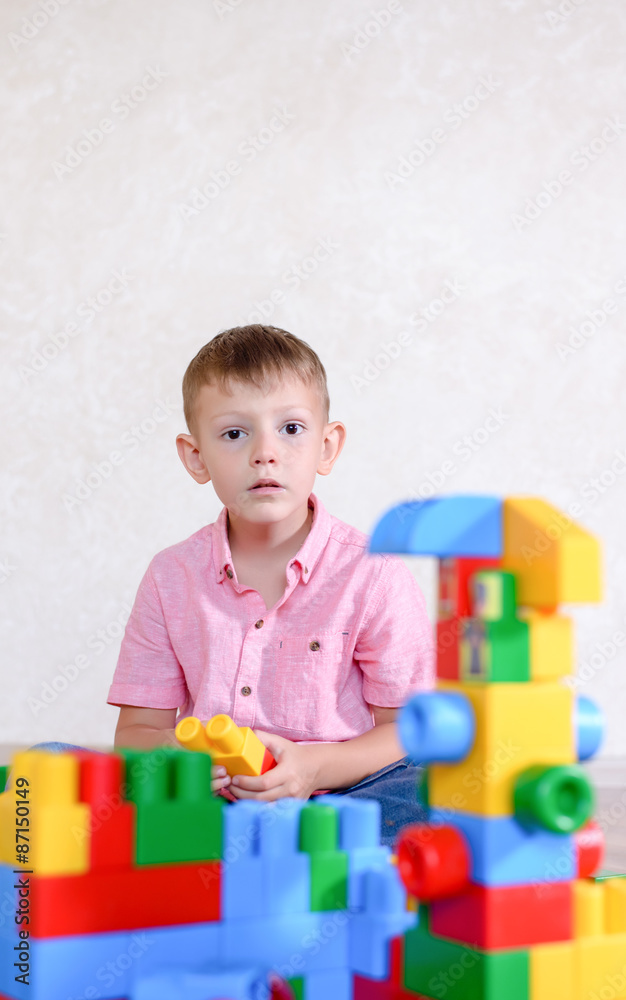 Cute Boy Playing with Colored Plastic Block Toys Cute Boy Playing with Colored Plastic Block Toys