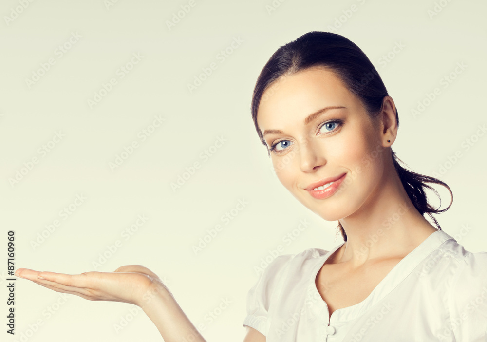 young businesswoman showing something or blank copyspase young businesswoman showing something or blank copyspase