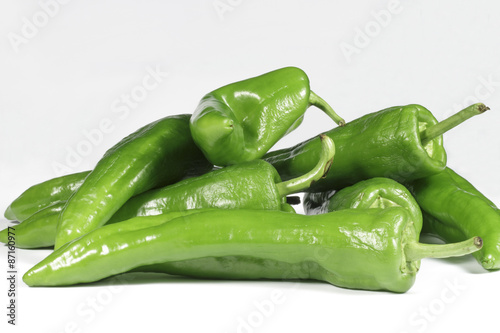 Green peppers on white