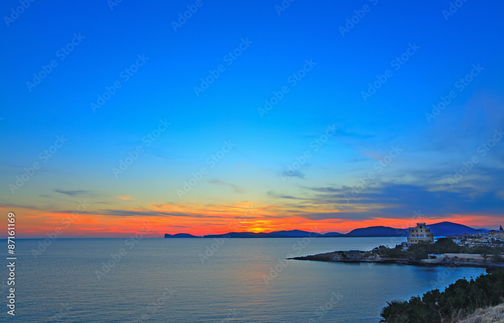 colorful sunset over Alghero shore