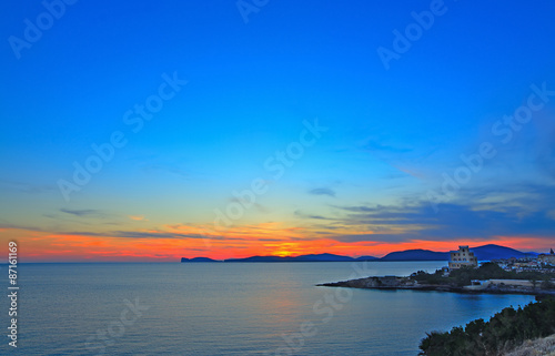 colorful sunset over Alghero shore