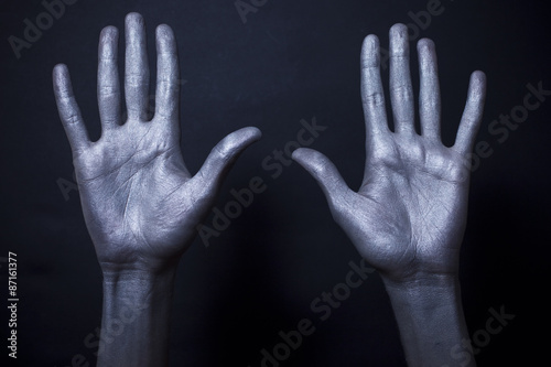  beautiful male hands in silver paint