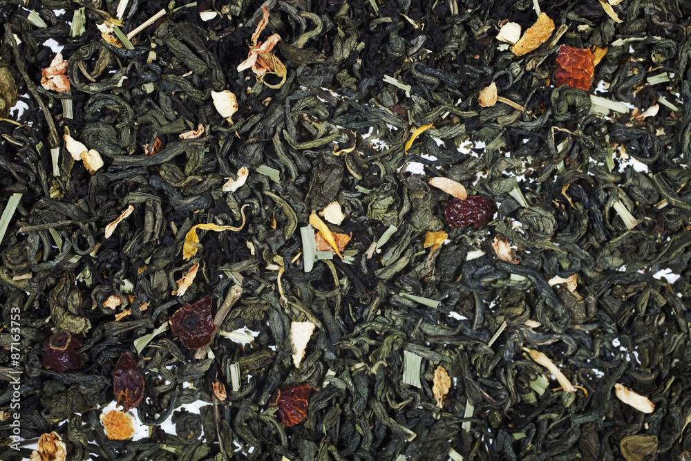 Texture of dry green tea with petals of flower and fruit Texture of dry green tea with petals of flower and fruit
