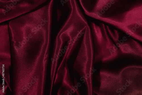 Texture of burgundy satin silk
