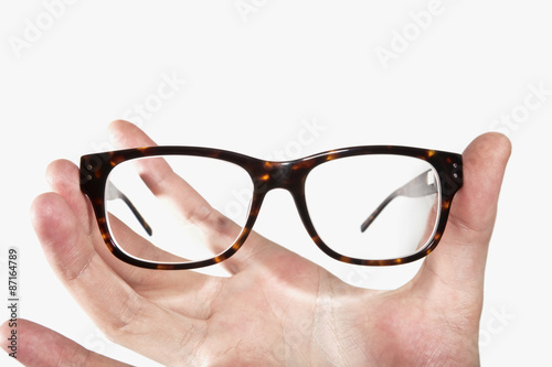 glasses in hands isolated on white background