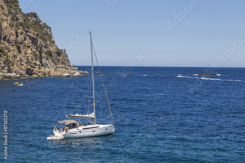 White boat on the Mediterranean shore