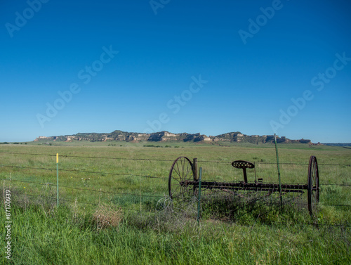 Wallpaper Mural Old piece of farm equipment left on the plains in Western Nebraska under a brilliant clear blue sky Torontodigital.ca