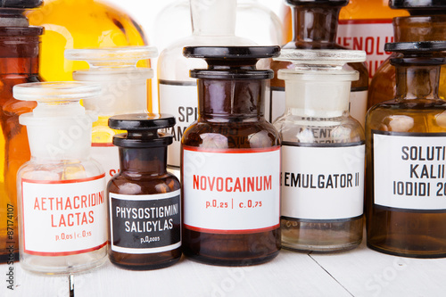 Bottle with novocaine with other vintage medicine bottles on woo photo