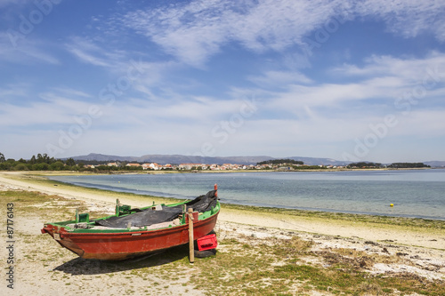 Red boat on the beach