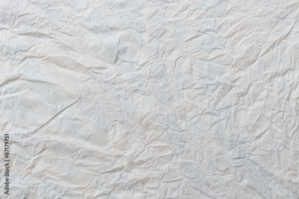 Grey crumpled paper texture and background