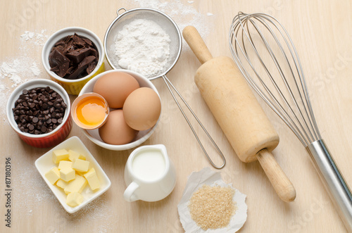Food ingredient and recipe for baking (cake,dessert,sweet,chocolate),kitchen utensil and tool on wooden background