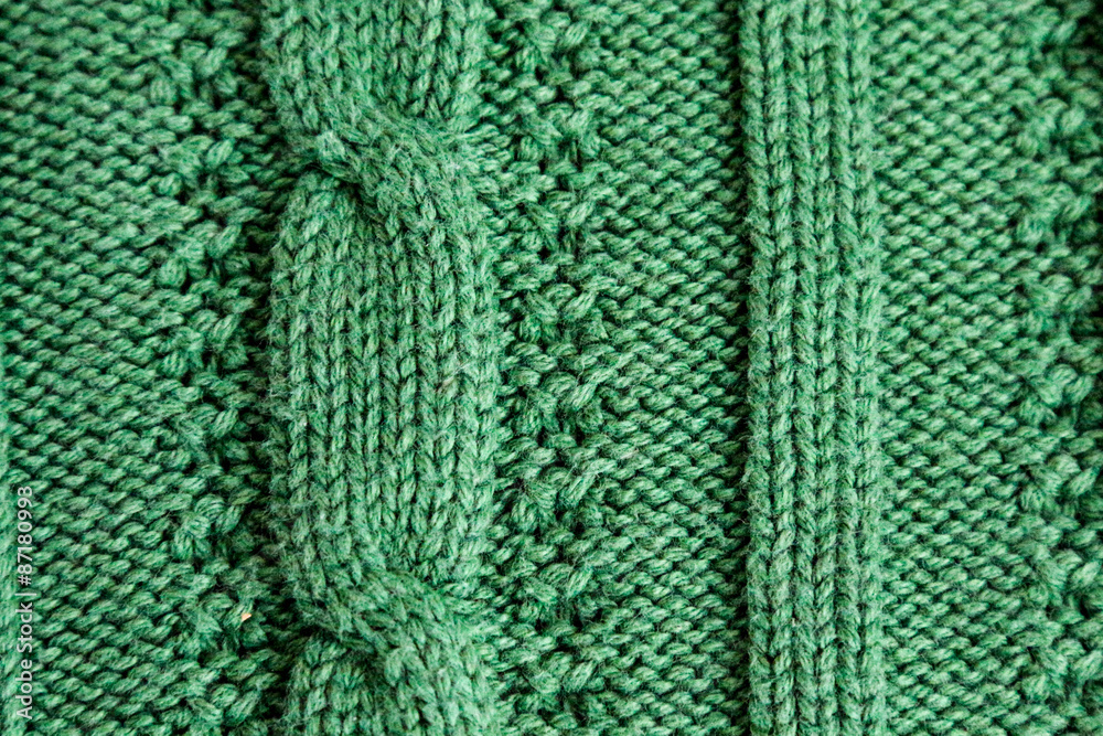 Green full frame cable knit close up of a sweater