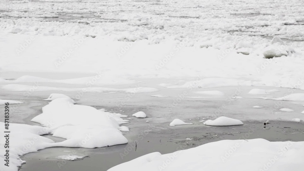 Frozen Danube river at winter - ice floating at water surface; Frozen Danube river at winter - ice floating at water surface;