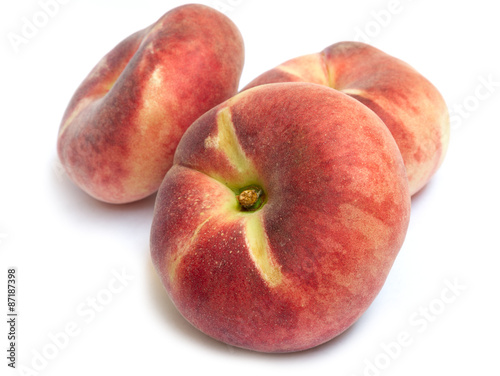 chinese flat donut peaches with leaf isolated on white