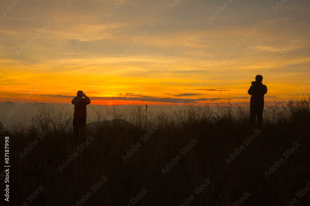 Silhouette of photography on the cliff