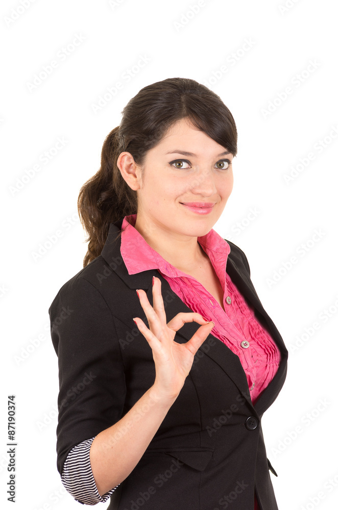 Hispanic woman wearing pink shirt and black blazer jacket making circle with right hand fingers as in expressing positive attitude. shot from side angle Hispanic woman wearing pink shirt and black blazer jacket making circle with right hand fingers as in expressing positive attitude. shot from side angle
