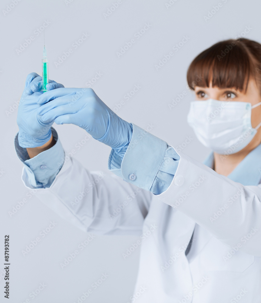 female doctor holding syringe with injection female doctor holding syringe with injection