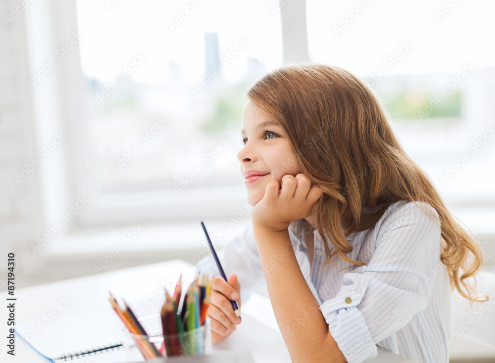 little student girl drawing and dreaming at school little student girl drawing and dreaming at school