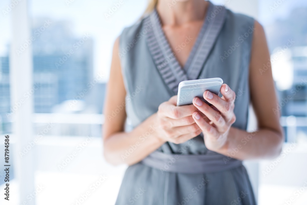 Close up view of businesswoman holding a phone Close up view of businesswoman holding a phone