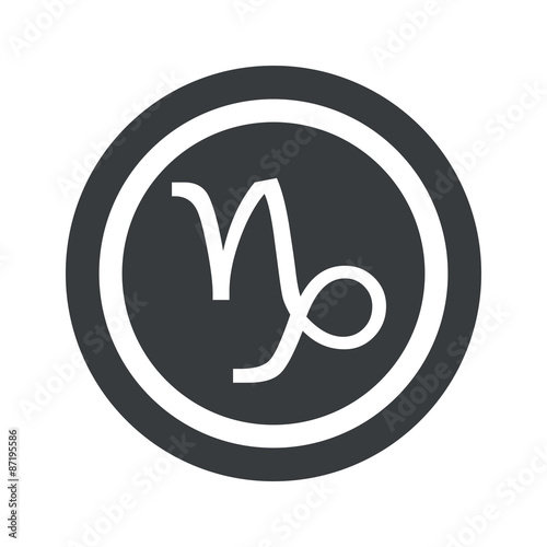 Round black Capricorn sign