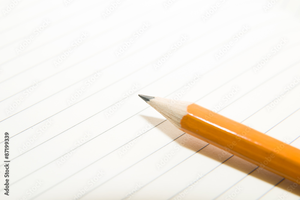 Opened notebook and pencil on the old tissue Opened notebook and pencil on the old tissue
