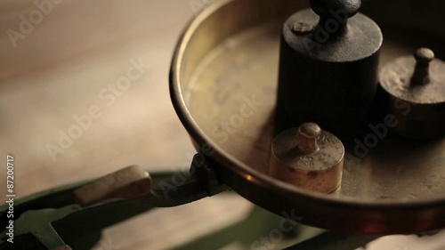 Weighting - vintage scale with iron weights; close up photo