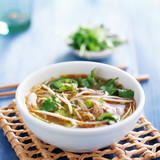 traditional pho tai beef vietnamese soup in bowl with cilantro and bean sprouts