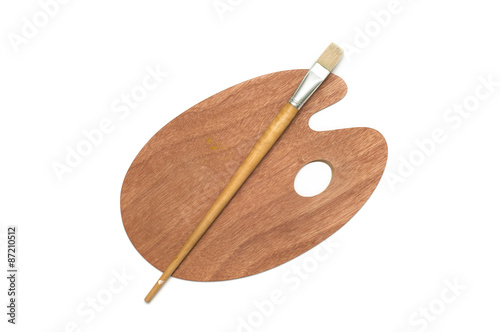 Wooden art palette with brush on white background