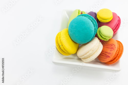 Macaron in plate on white background.