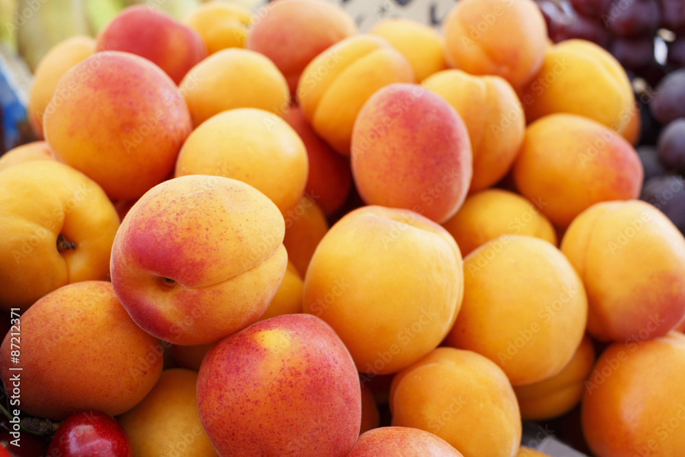 Organic apricots displayed at the market/Fresh juicy colorful fruit at the supermarket. Organic apricots displayed at the market/Fresh juicy colorful fruit at the supermarket.