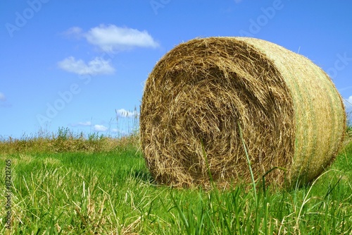 Straw bales under blue sky