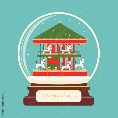 Merry christmas glass ball with carousel horses. Celebratory