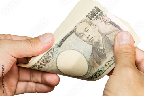 counting Japanese currency with hands photo