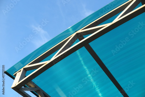 Arc polycarbonate canopy against a blue sky photo