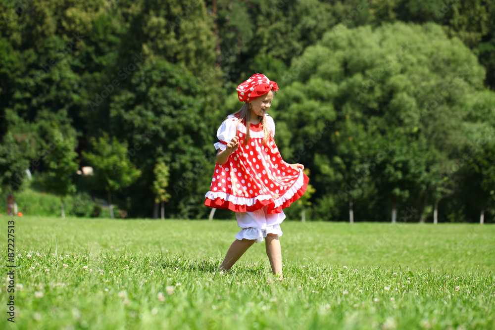Little girl in a red polka-dot sundress into a major run on the Little girl in a red polka-dot sundress into a major run on the