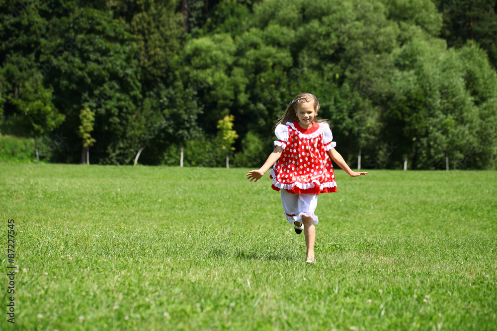 Little girl in a red polka-dot sundress into a major run on the Little girl in a red polka-dot sundress into a major run on the