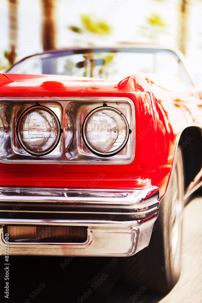 Red classic car driving fast, with motion blur background. Close up view.  Stock Photo | Adobe Stock