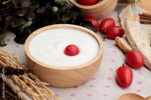 White yogurt and fresh cherry tomatoes